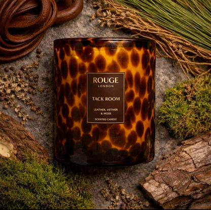Tack Room 3 wick Candle with a tortoiseshell pattern. Leather, Vetiver & Moss on a rustic background.